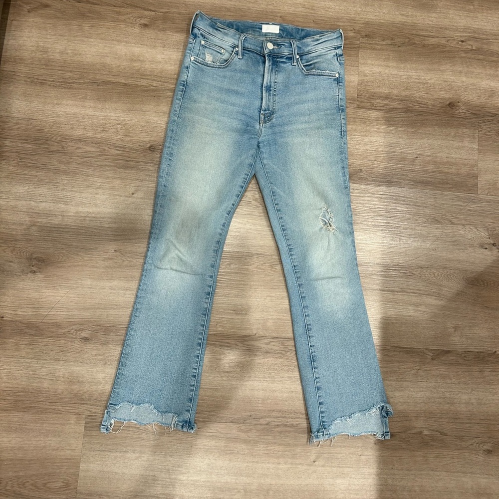 MOTHER Light Blue Flare Jeans with Distressed Hem